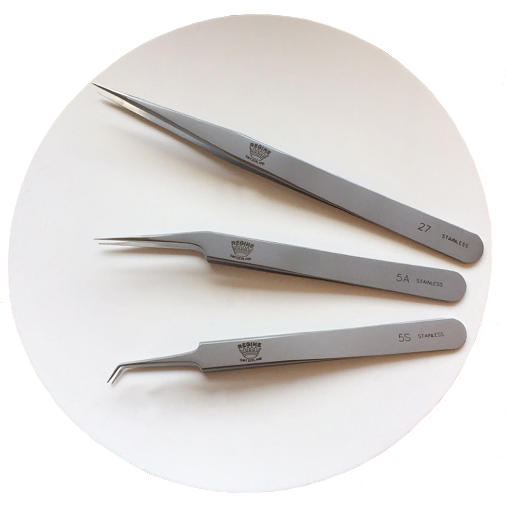 Professional eyelash extension tweezers and The Lashe Silicone Round for lash artists